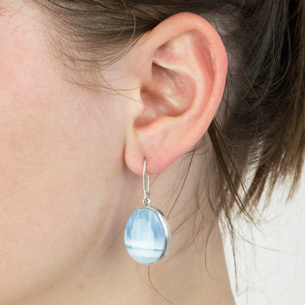 Blue opal drop earrings on model