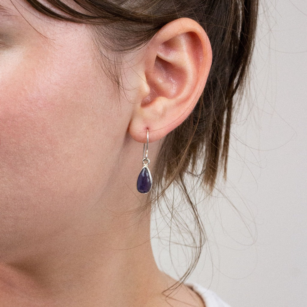 Iolite drop earrings on model