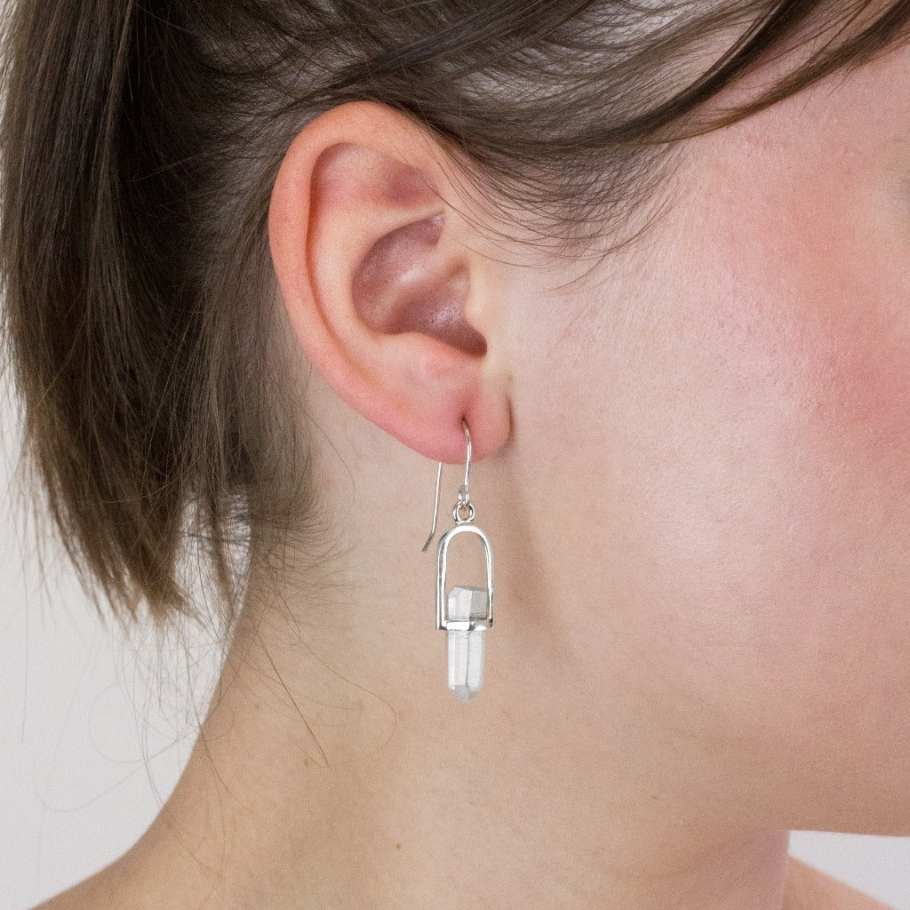 Laser Quartz drop earrings on model