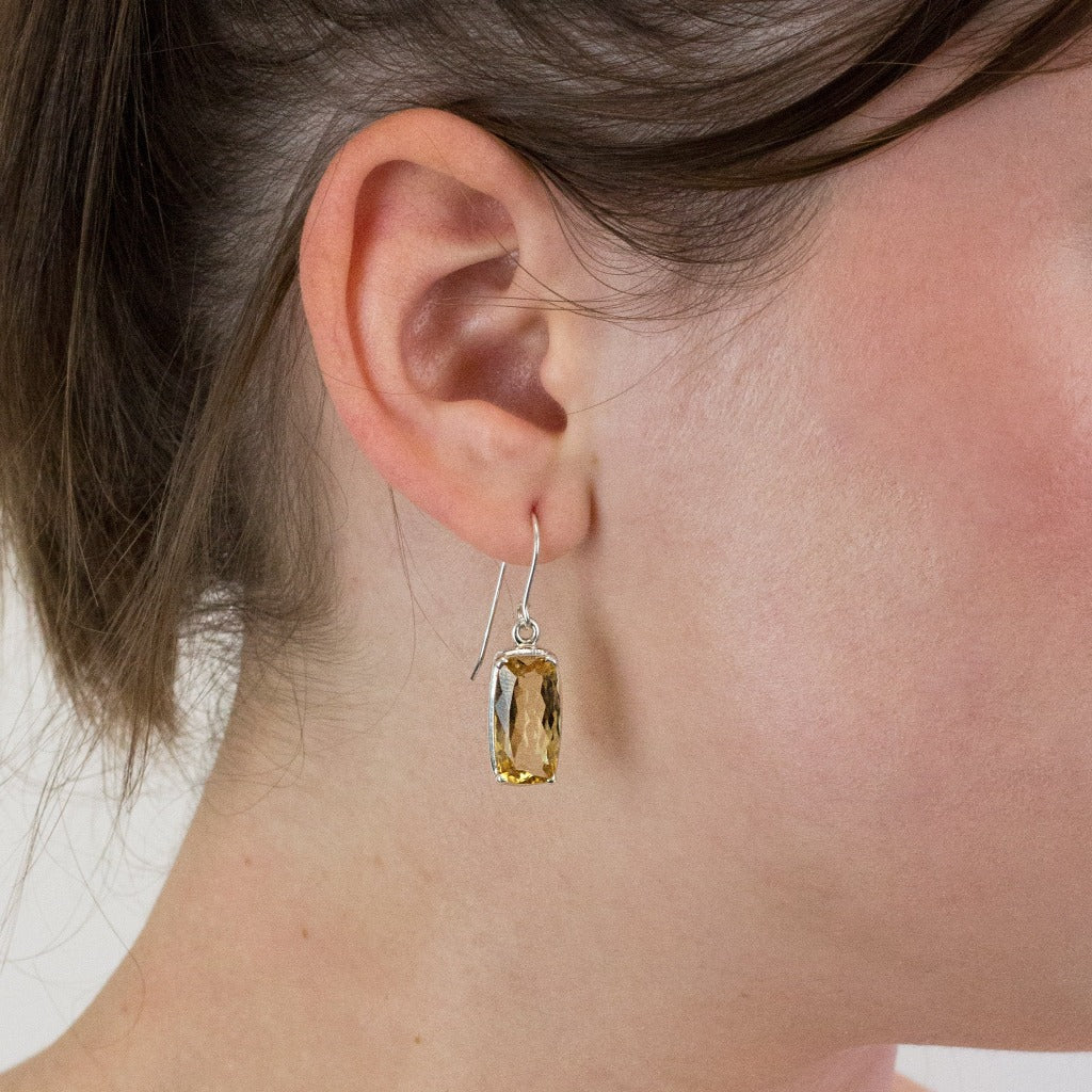 Citrine drop earrings on model
