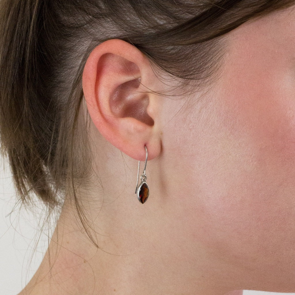 Garnet drop earrings on model