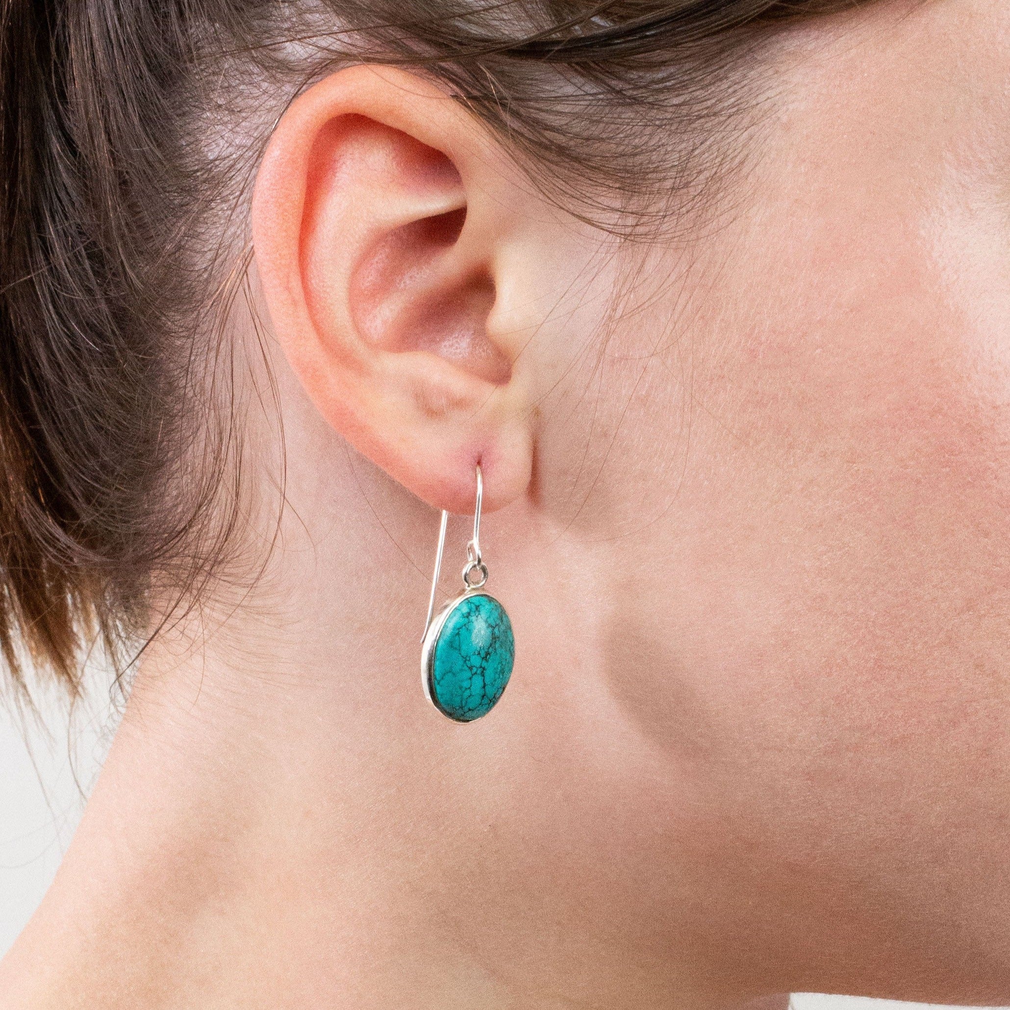 Tibetan Turquoise drop earrings on model