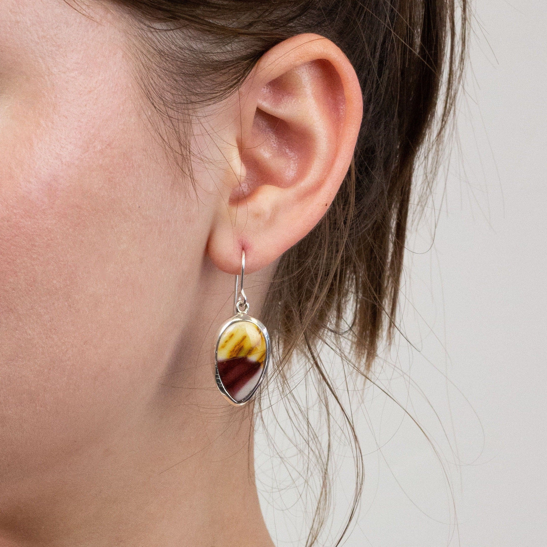 Mookaite drop earrings on model