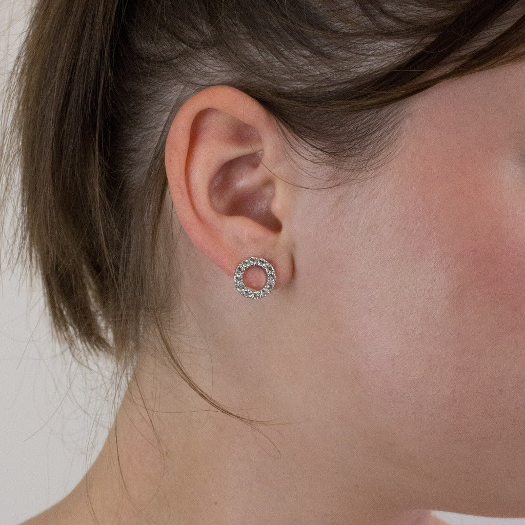 Clear quartz stud earrings on model
