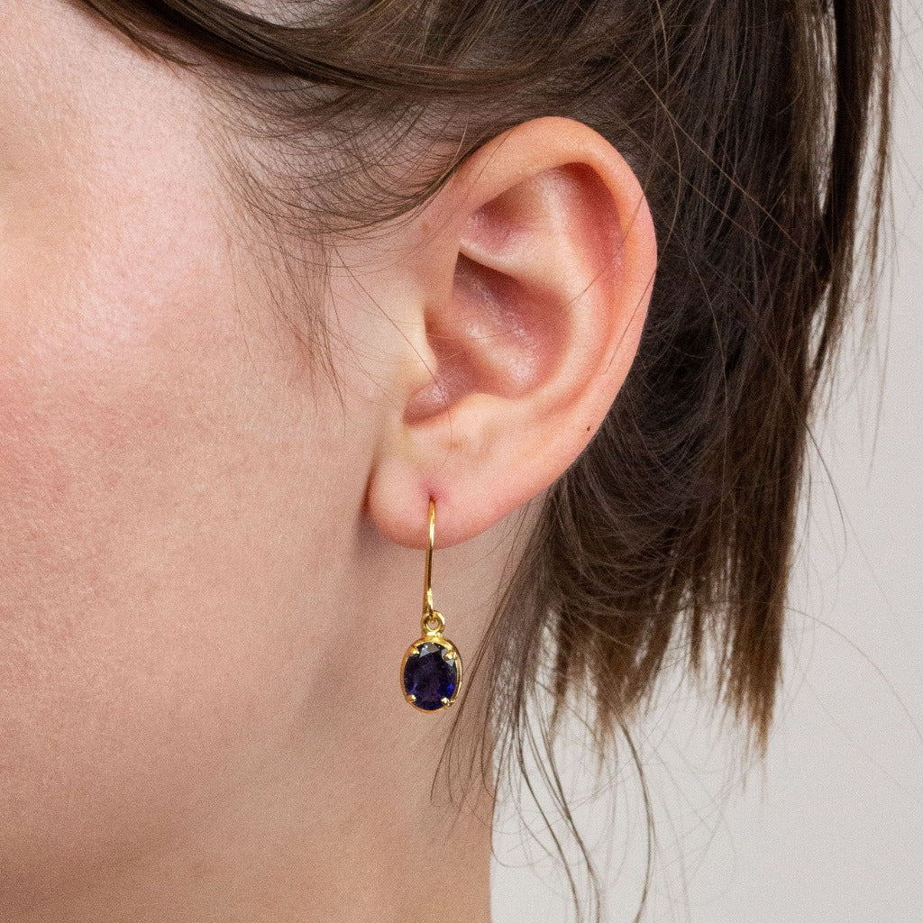 yellow gold Iolite drop earrings on model