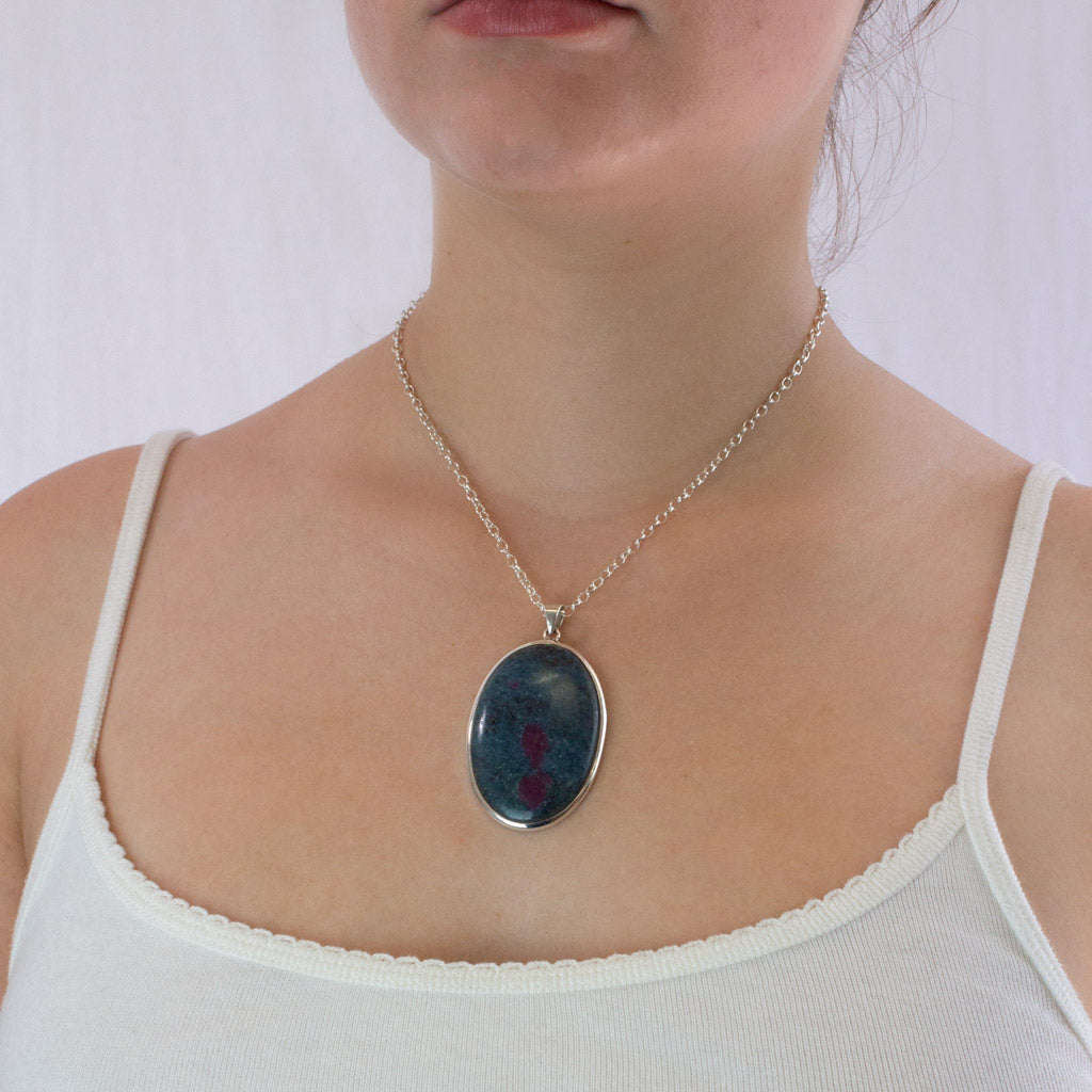 cabochon oval Ruby in Kyanite necklace on model