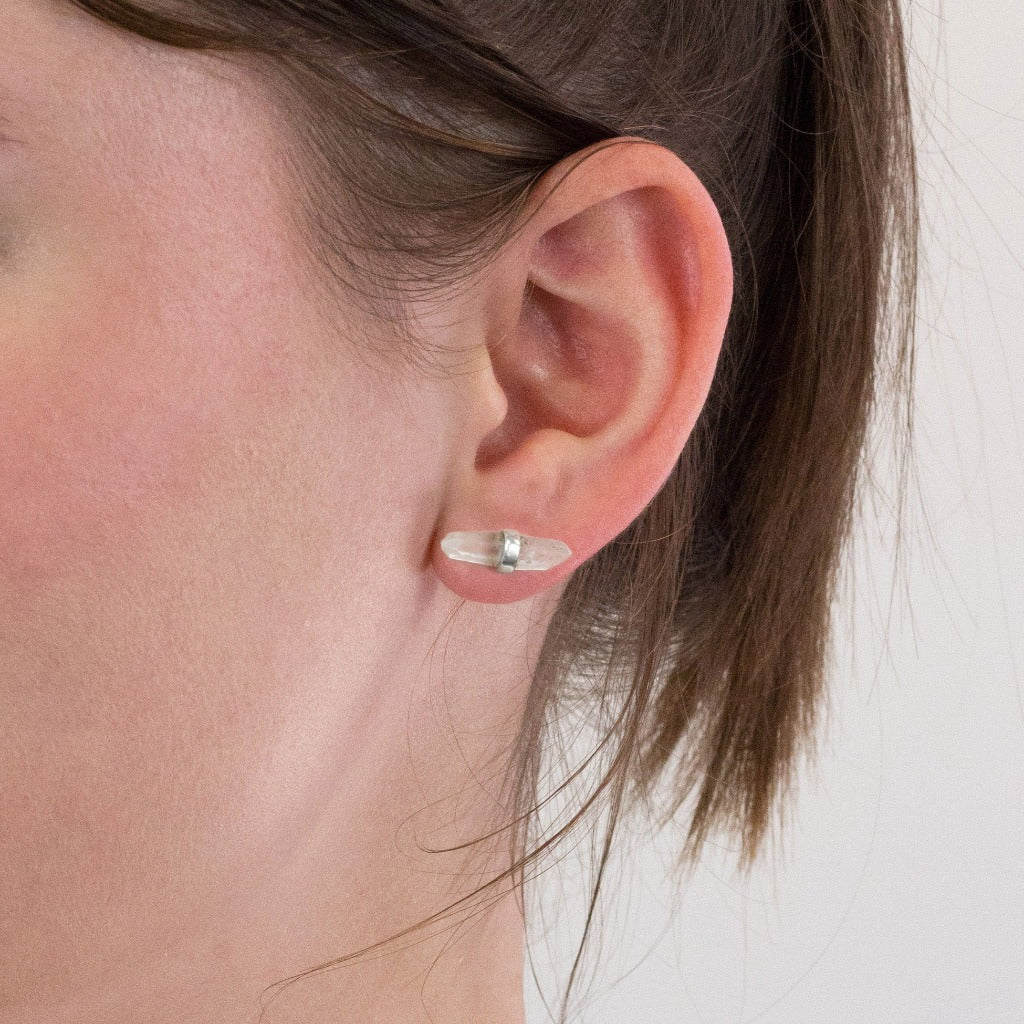 Laser Quartz stud earrings on model