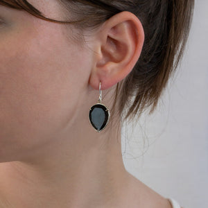 Onyx drop earrings on model