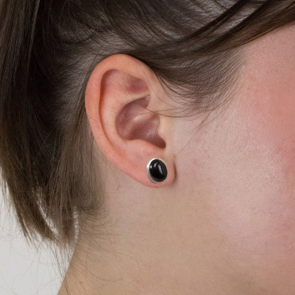 Onyx stud earrings on model