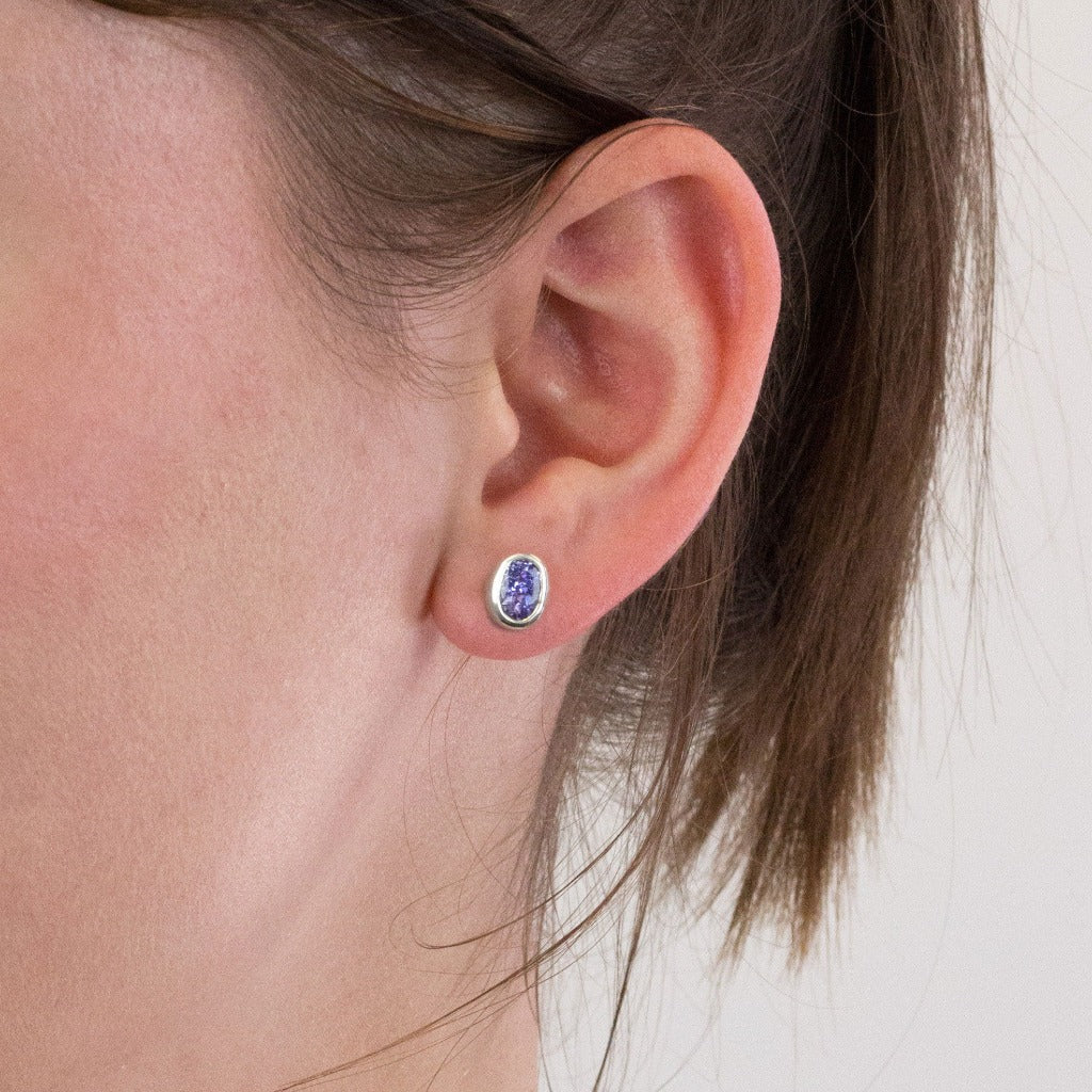 Tanzanite stud earrings on model