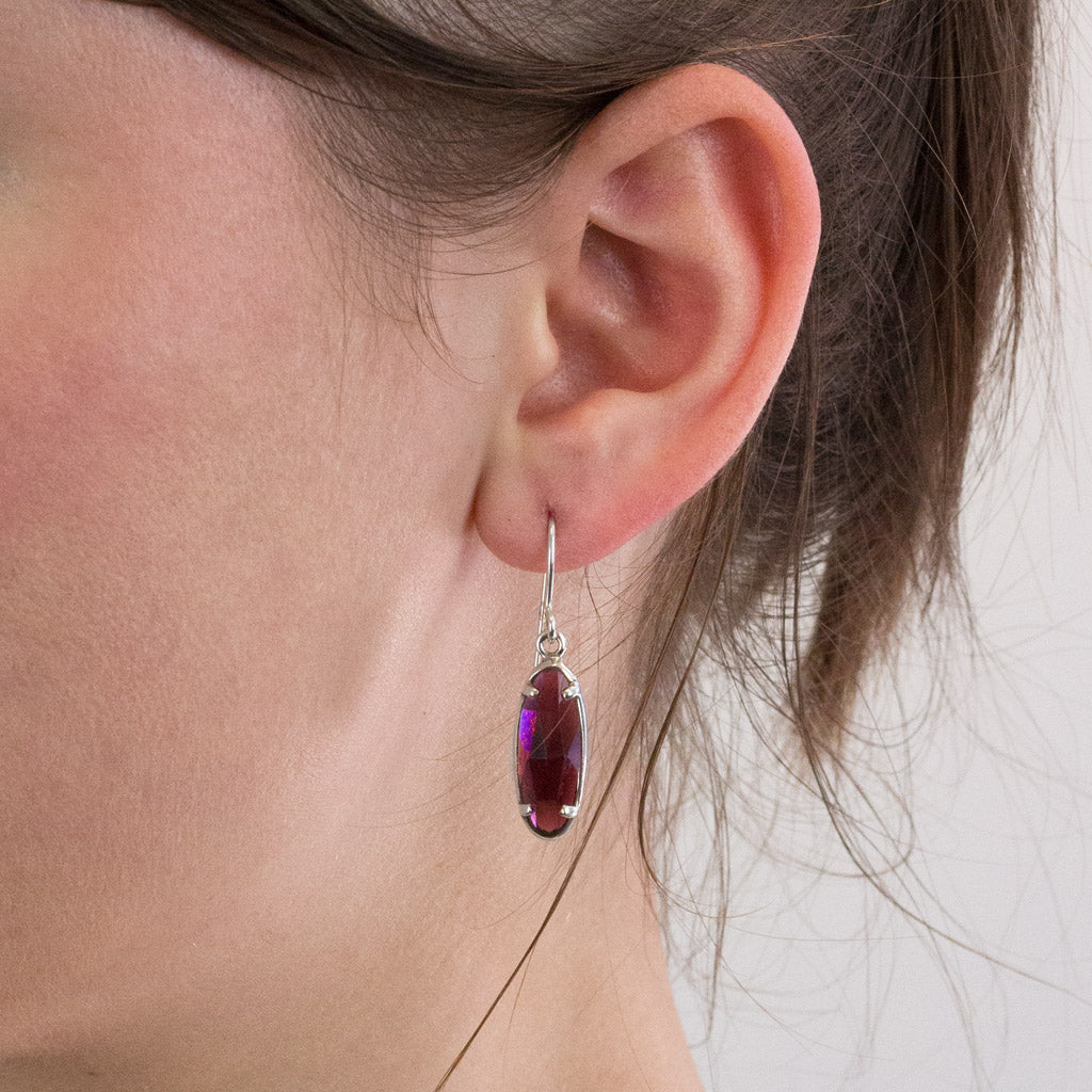 Garnet drop earrings on model