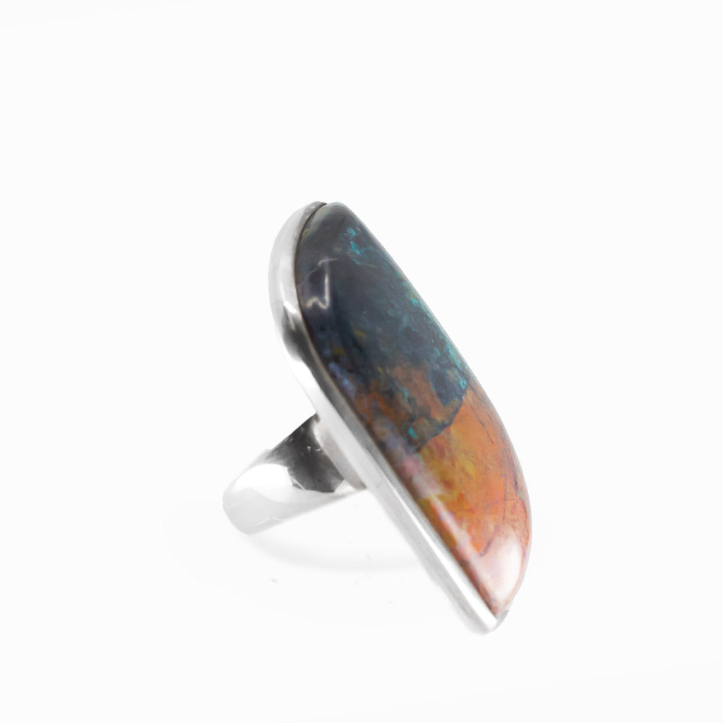 Chrysocolla Cuprite freeform cabochon ring in polished sterling silver with vivid teal blue, turquoise and warm copper mineral patterns.