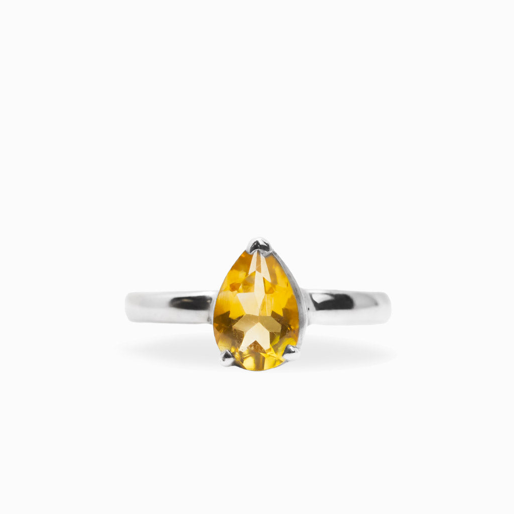 Pear-shaped faceted golden Citrine ring in polished 925 sterling silver with a three-prong setting and slender silver band.
