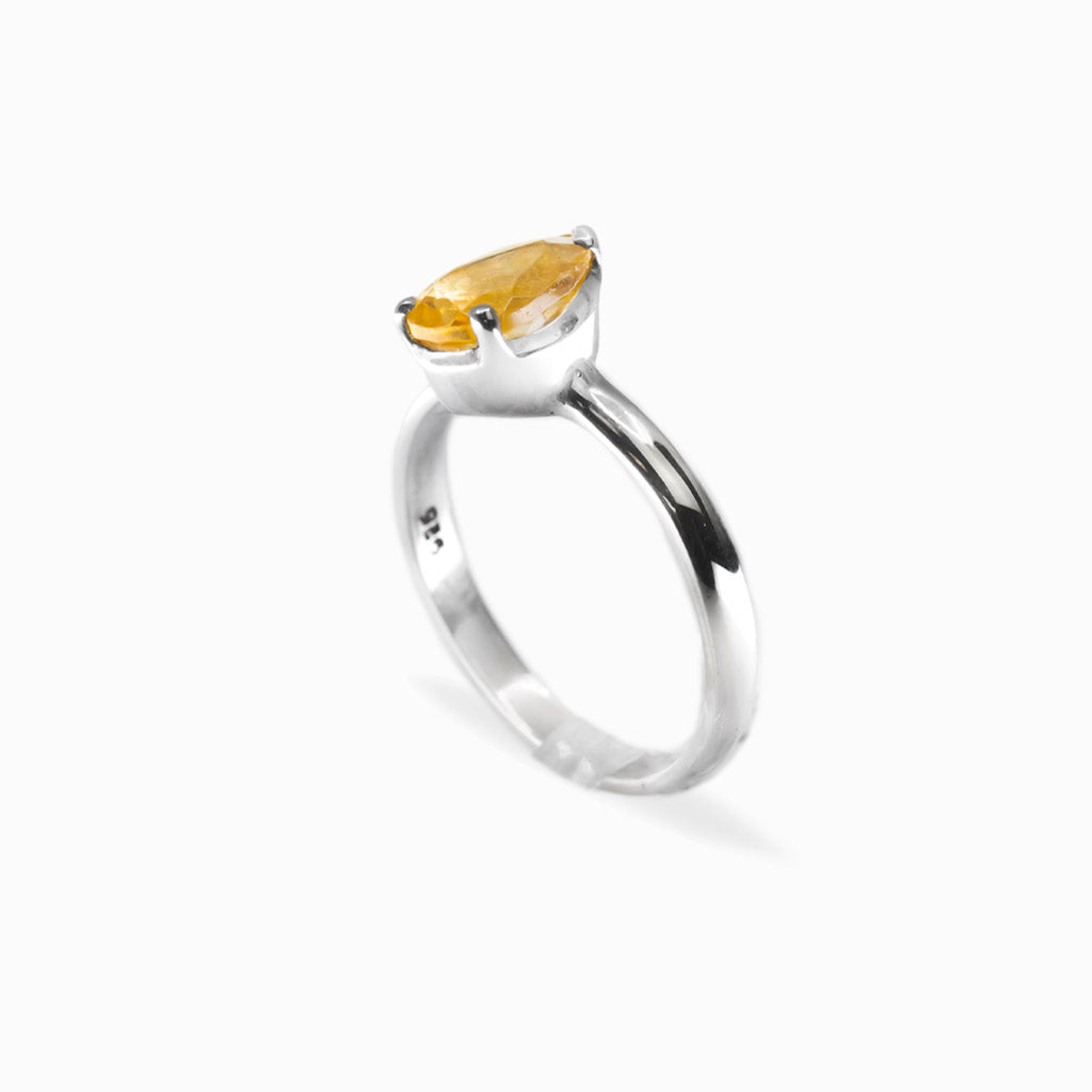 Pear-shaped faceted golden Citrine ring in polished 925 sterling silver with a three-prong setting and slender silver band.
