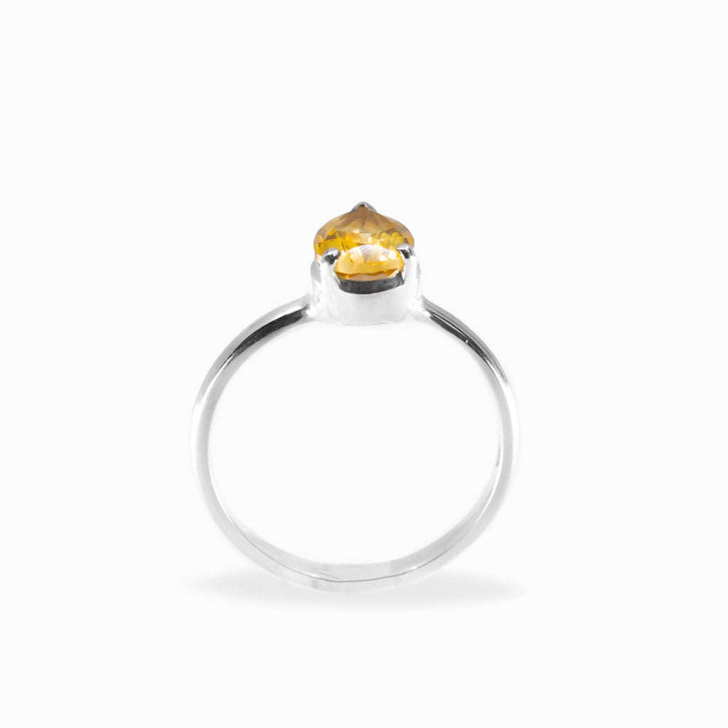 Pear-shaped faceted golden Citrine ring in polished 925 sterling silver with a three-prong setting and slender silver band.