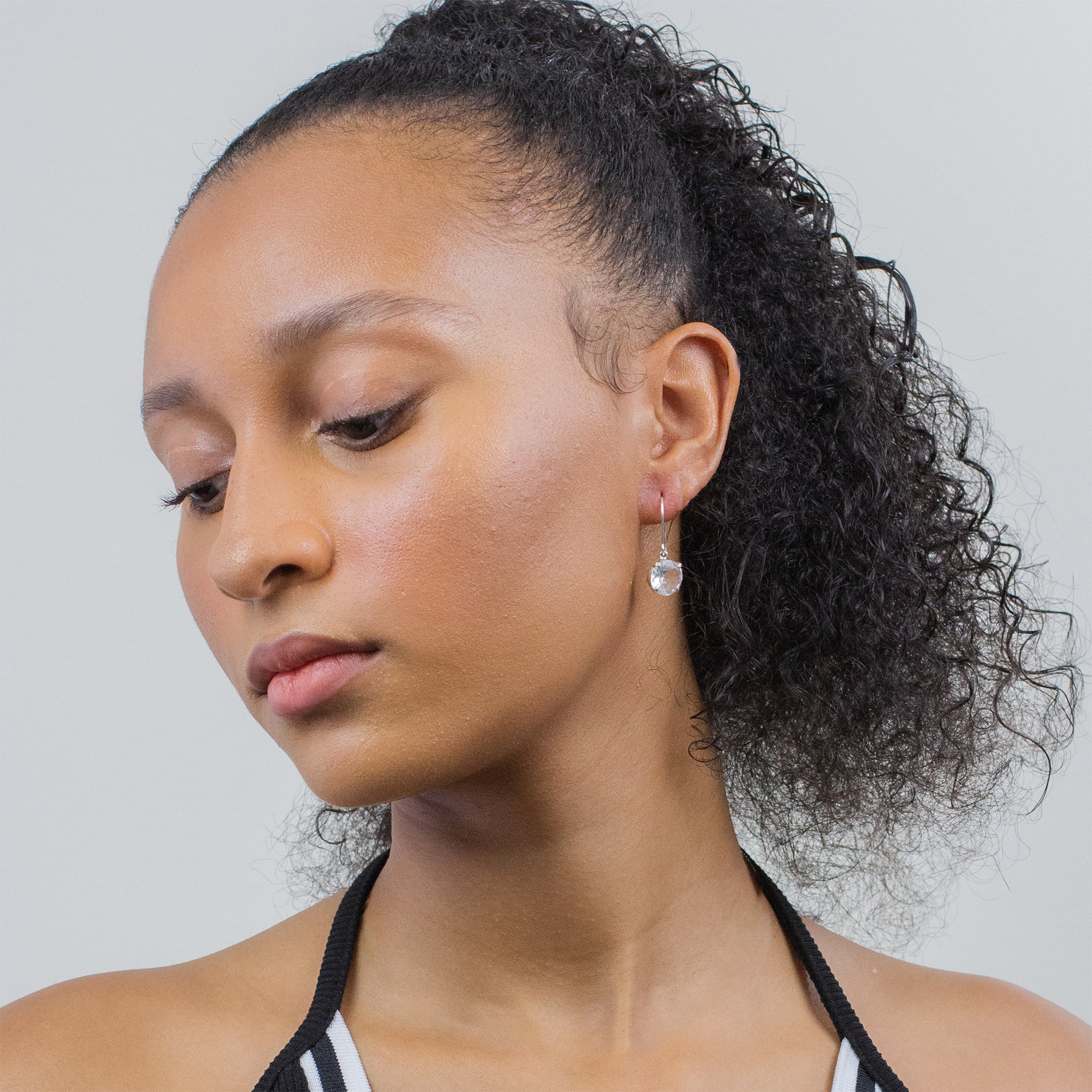 CLEAR QTZ FAC DROP EARRINGS ON MODEL