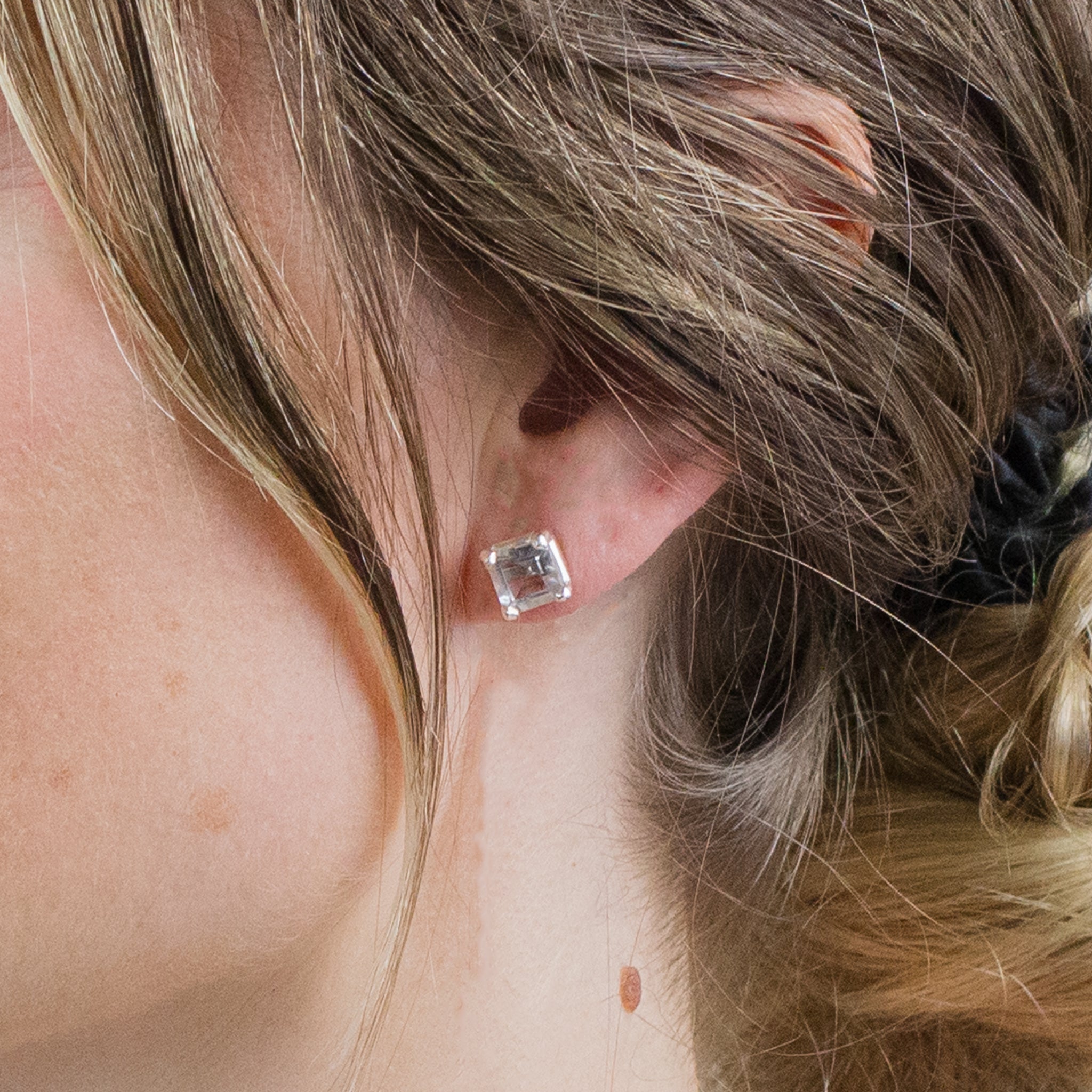 CLEAR QTZ FAC STUDS ON MODEL