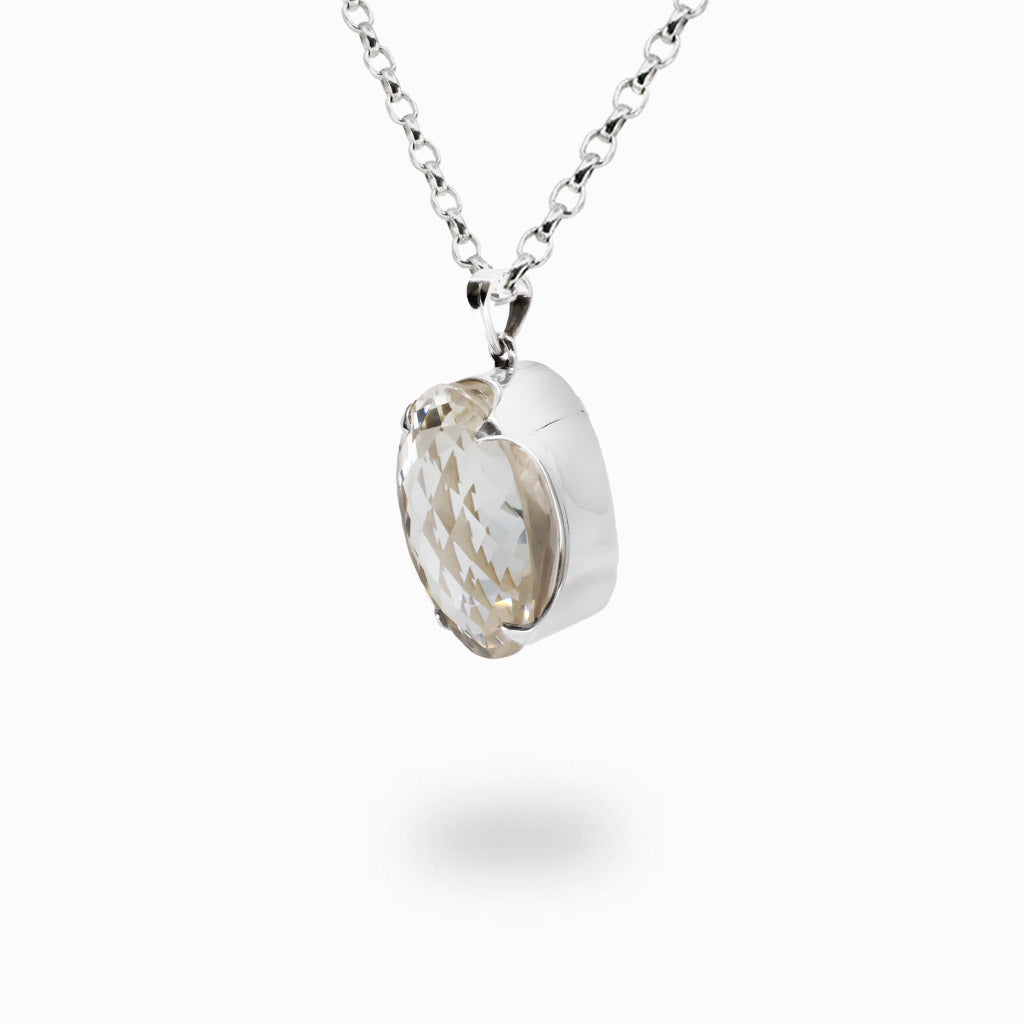 Faceted oval Clear Quartz pendant necklace in sterling silver featuring a transparent natural crystal gemstone.