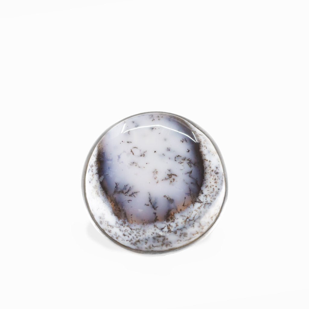 Dendritic Opal round cabochon ring in polished sterling silver with milky white tones and delicate natural branch-like dendritic inclusions.