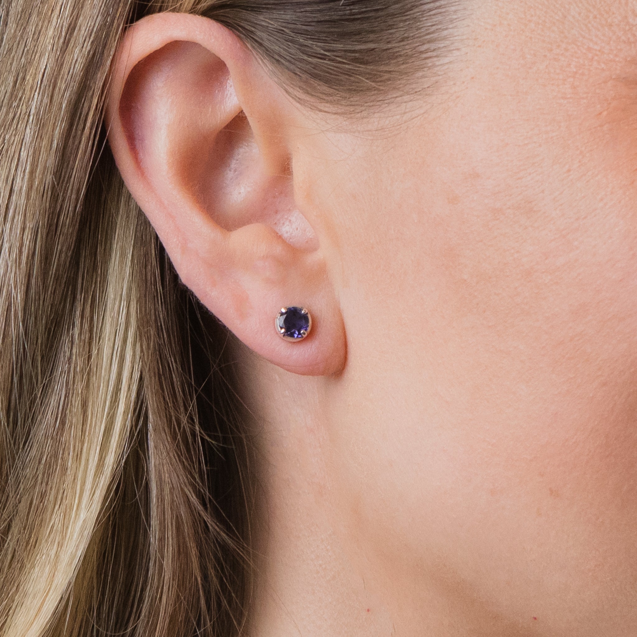 FACETED IOLITE STUD EARRINGS ON MODEL