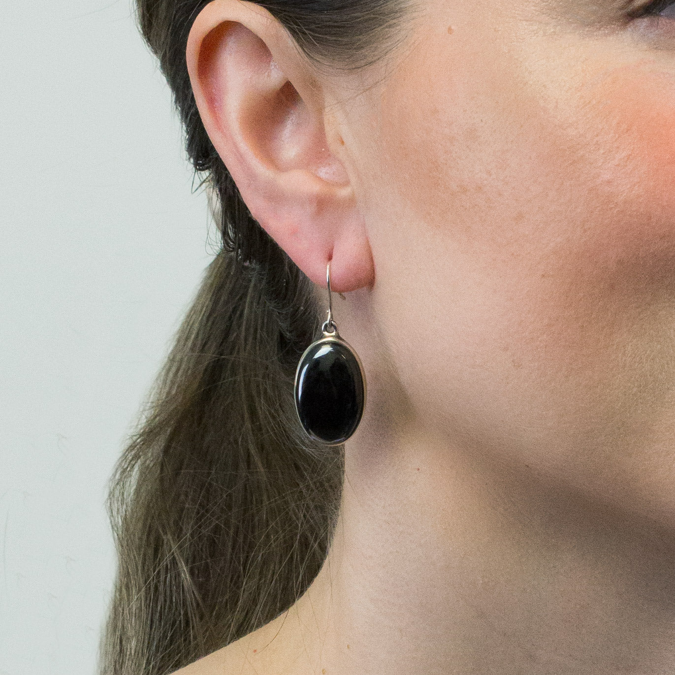 hematite drop earrings on model