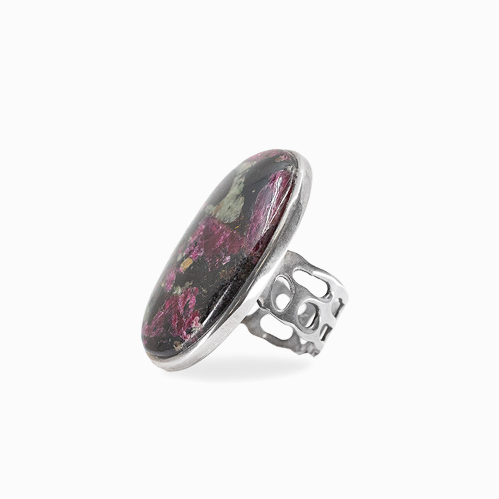 Oval Eudialyte cabochon with magenta, black and green natural patterning set in 925 sterling silver.