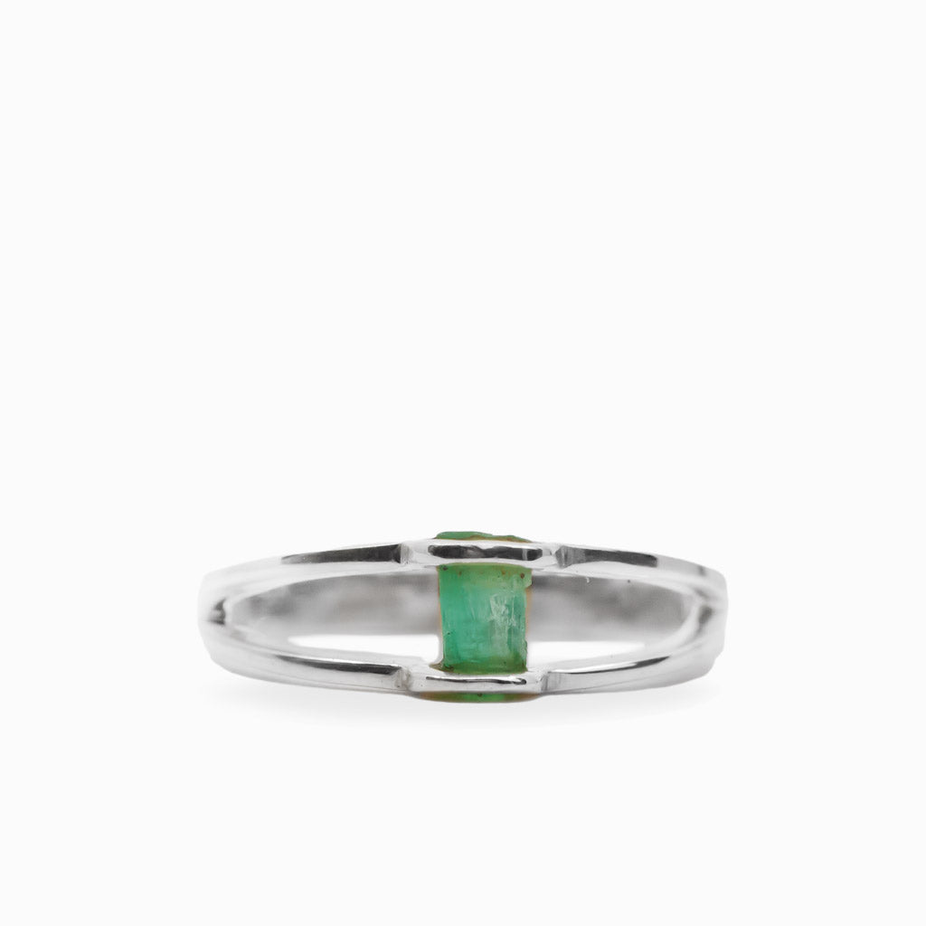 Raw rectangular green Emerald ring in polished 925 sterling silver with an open horizontal silver setting.