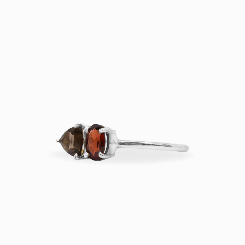 Faceted Garnet and pear-shaped Smoky Quartz two-stone ring in polished 925 sterling silver with a delicate silver band.