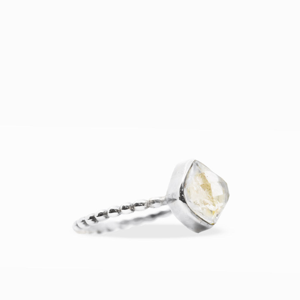 Clear diamond-shaped Herkimer Diamond Quartz ring with natural inclusions, sterling silver bezel setting, and textured beaded band.