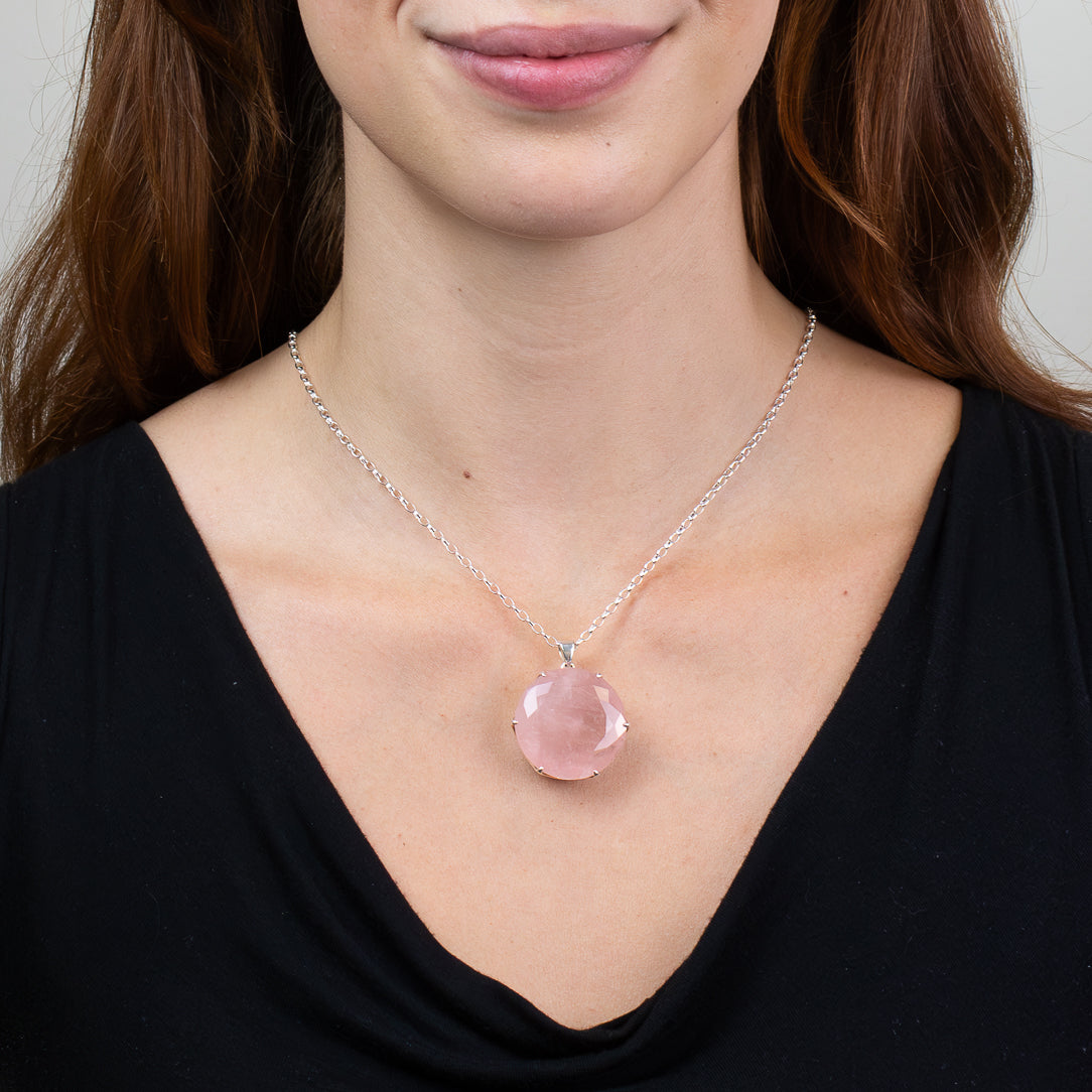 Faceted Rose Quartz pendant necklace in sterling silver featuring a soft translucent pink gemstone.