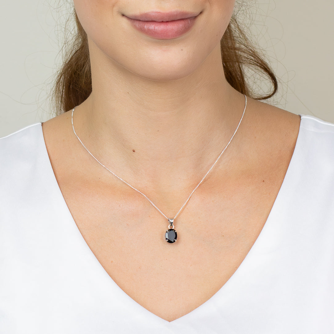 Faceted oval tektite necklace in sterling silver ON MODEL