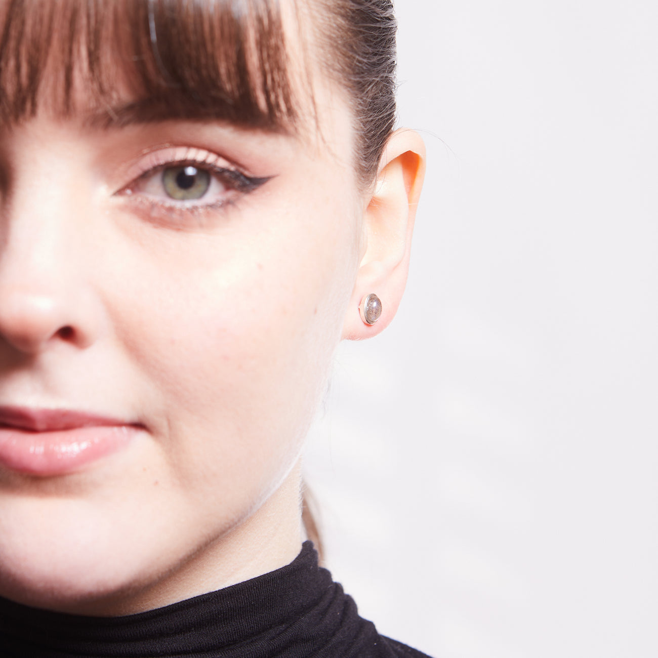 CABOCHON OVAL LABRADORITE STUD EARRINGS STERLING SILVER ON MODEL | MADE IN EARTH 