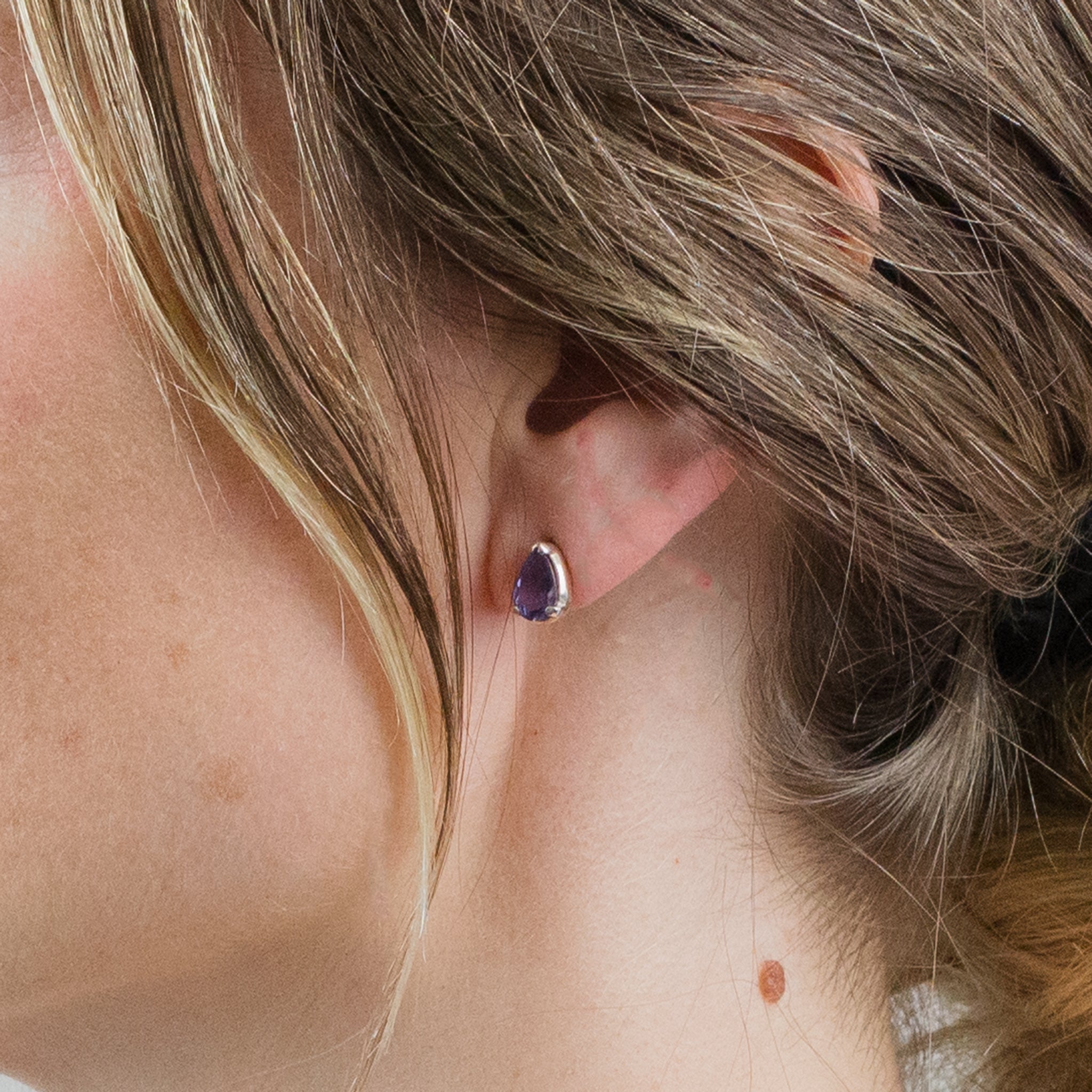 IOLITE FAC TEAR CLAW STUDS ON MODEL