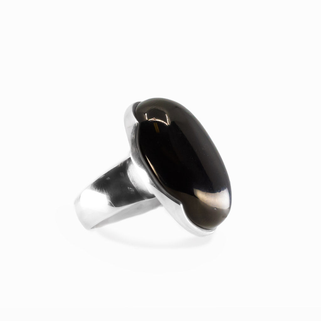 Jet oval cabochon ring in polished sterling silver featuring a smooth high-polish surface and rich glossy black coloring.