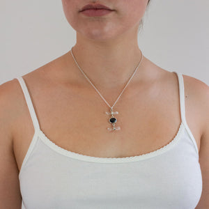 faceted onyx and raw laser quartz necklace on model