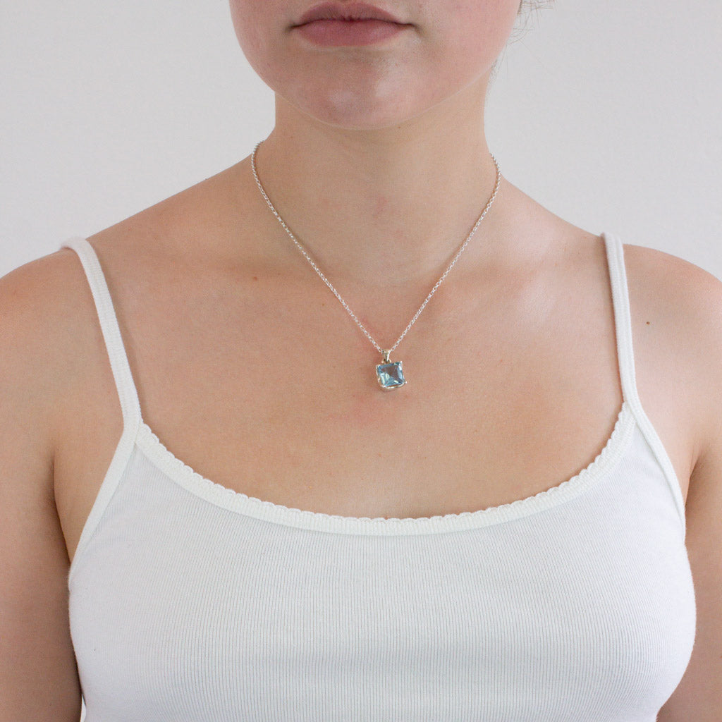 Faceted Square Blue Topaz necklace on model