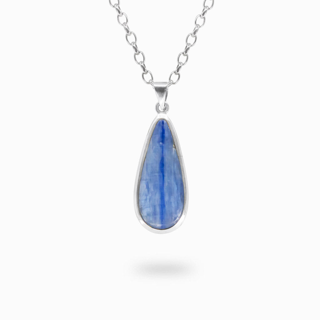 Elongated pear-shaped blue Kyanite cabochon pendant with natural vertical striations in polished 925 sterling silver.