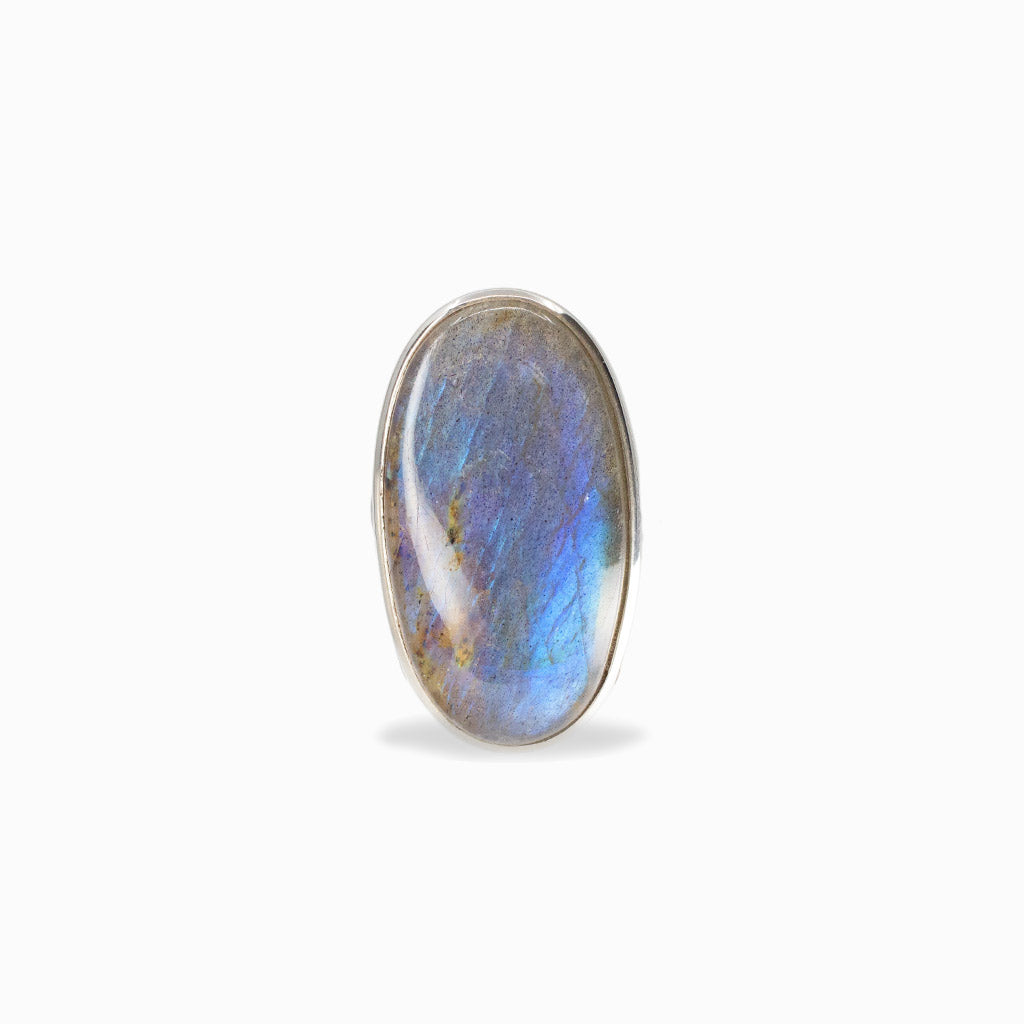 Elongated oval Labradorite cabochon with vivid blue flash set in polished 925 sterling silver.