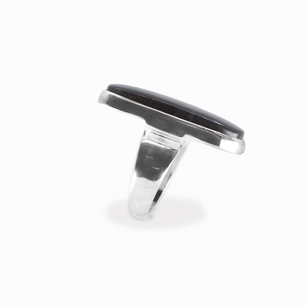 Spectralite Labradorite rectangular cabochon ring in polished sterling silver displaying an intense electric blue natural flash.