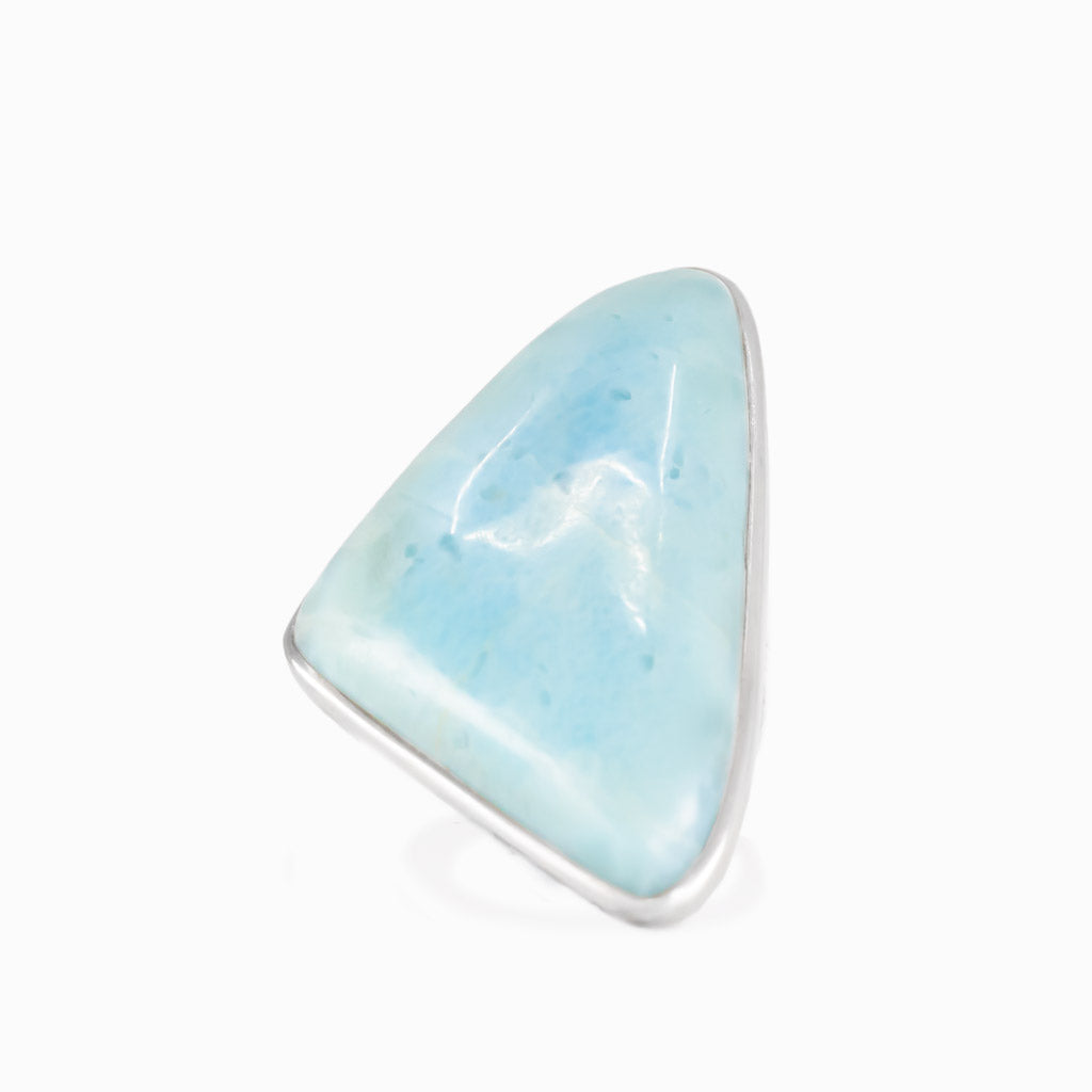 Larimar triangle cabochon ring in sterling silver bezel. Ocean-blue gemstone with natural marbling in a modern, sculptural design.