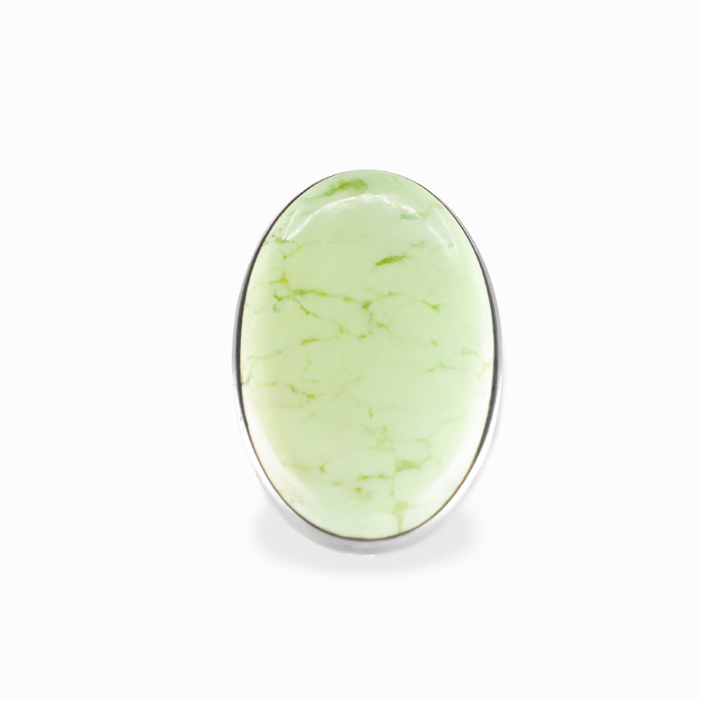 Lemon Chrysoprase oval cabochon ring in polished sterling silver with a luminous pale yellow-green color and delicate natural veining.