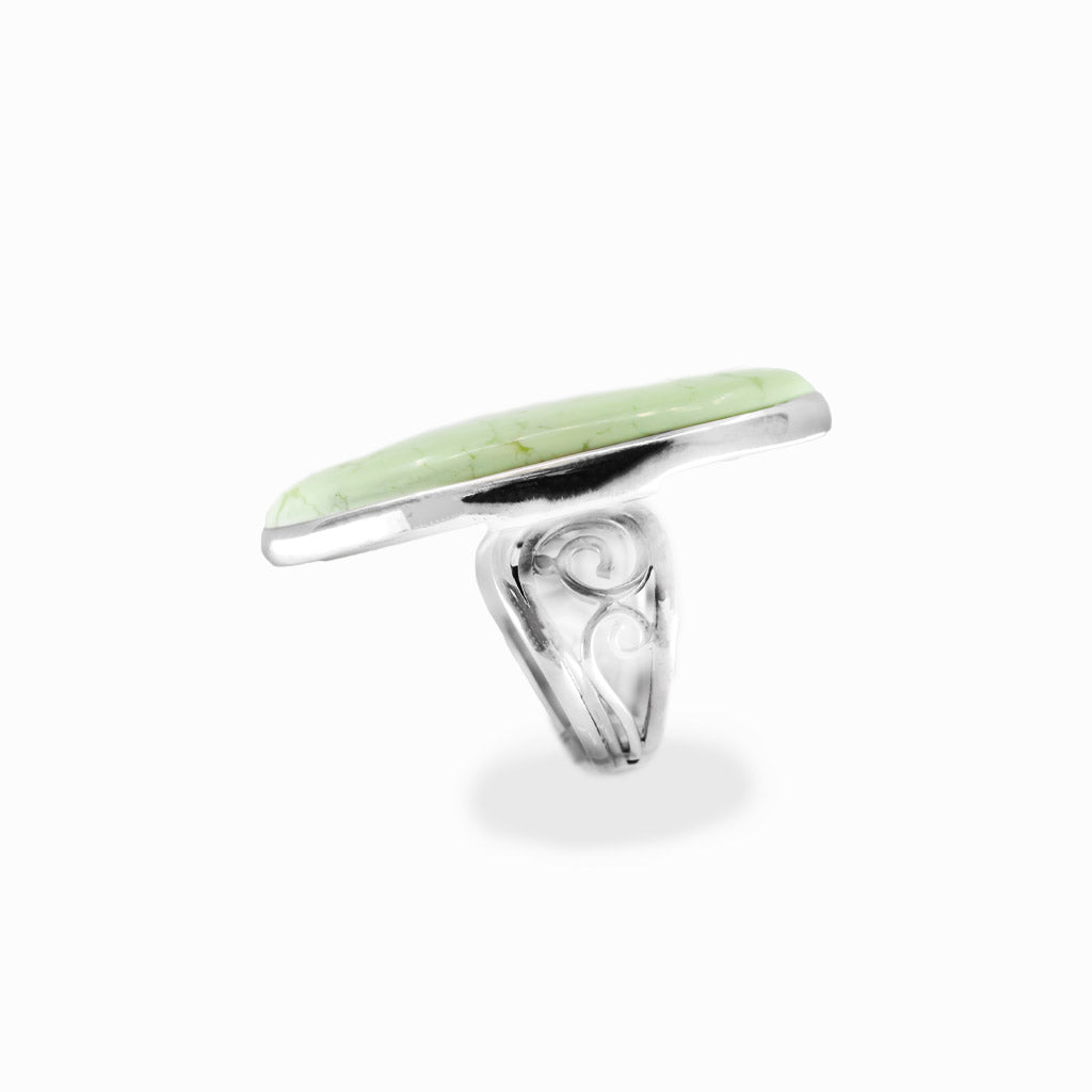 Lemon Chrysoprase oval cabochon ring in polished sterling silver with a luminous pale yellow-green color and delicate natural veining.
