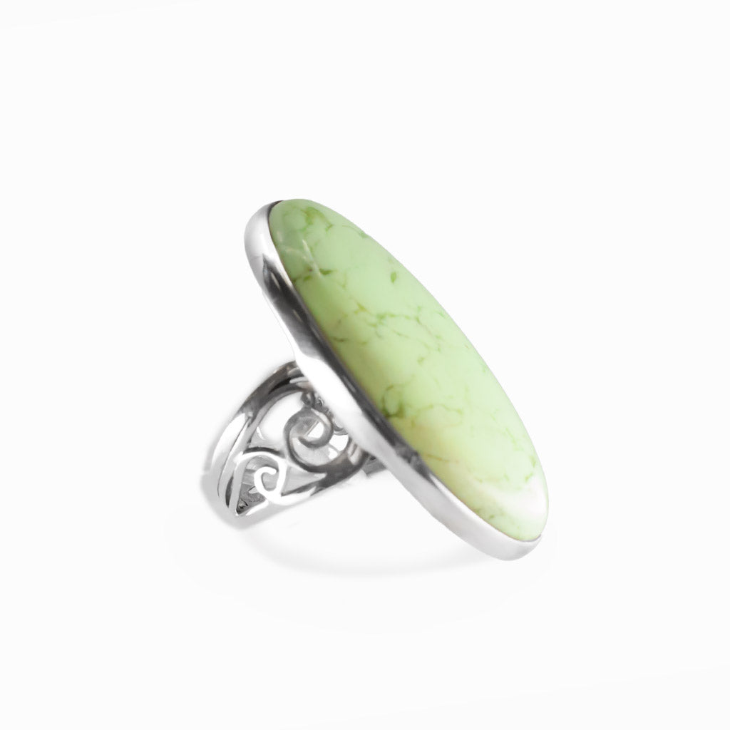 Lemon Chrysoprase oval cabochon ring in polished sterling silver with a luminous pale yellow-green color and delicate natural veining.
