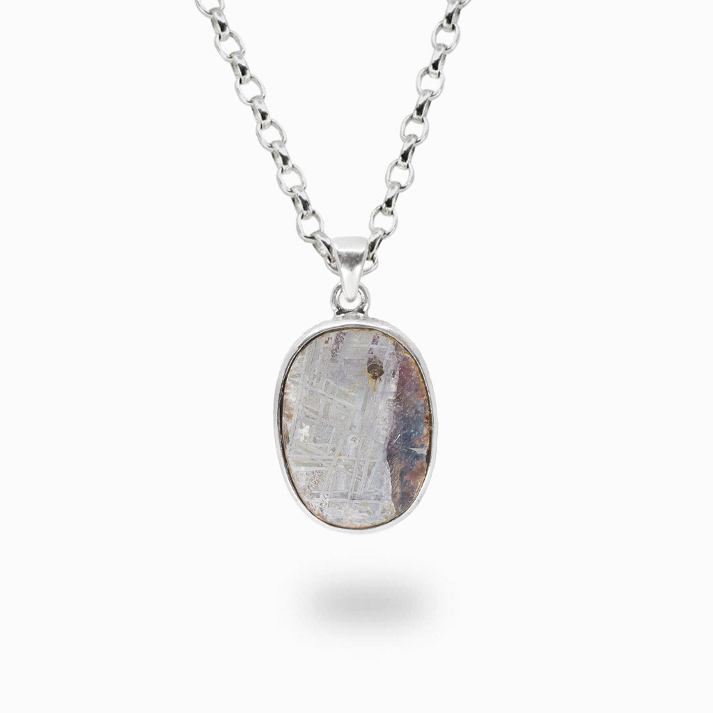 Raw oval Gibeon meteorite necklace in sterling silver