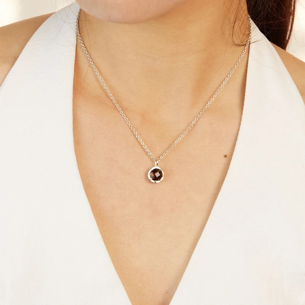 Round faceted brown Smoky Quartz gemstone set in polished sterling silver pendant necklace.
