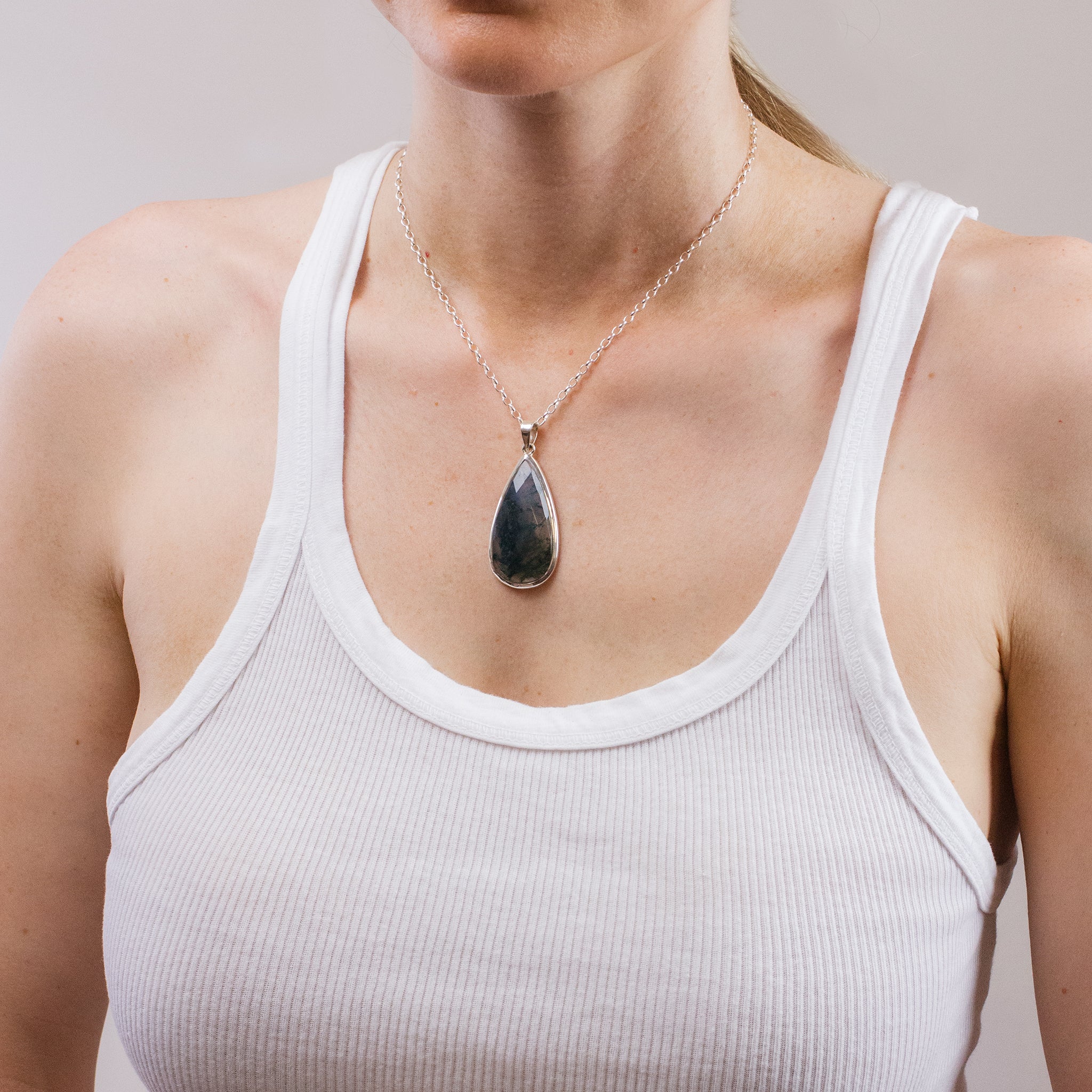 MOSS AGATE FACETED TEAR NECKLACE ON MODEL