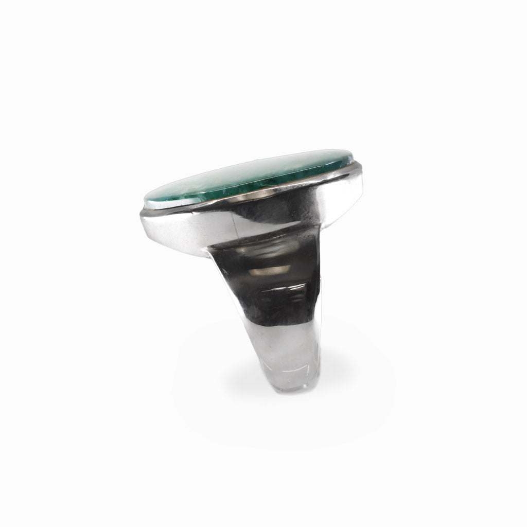 Oval Moss Agate cabochon sterling silver statement ring with natural green moss-like inclusions.