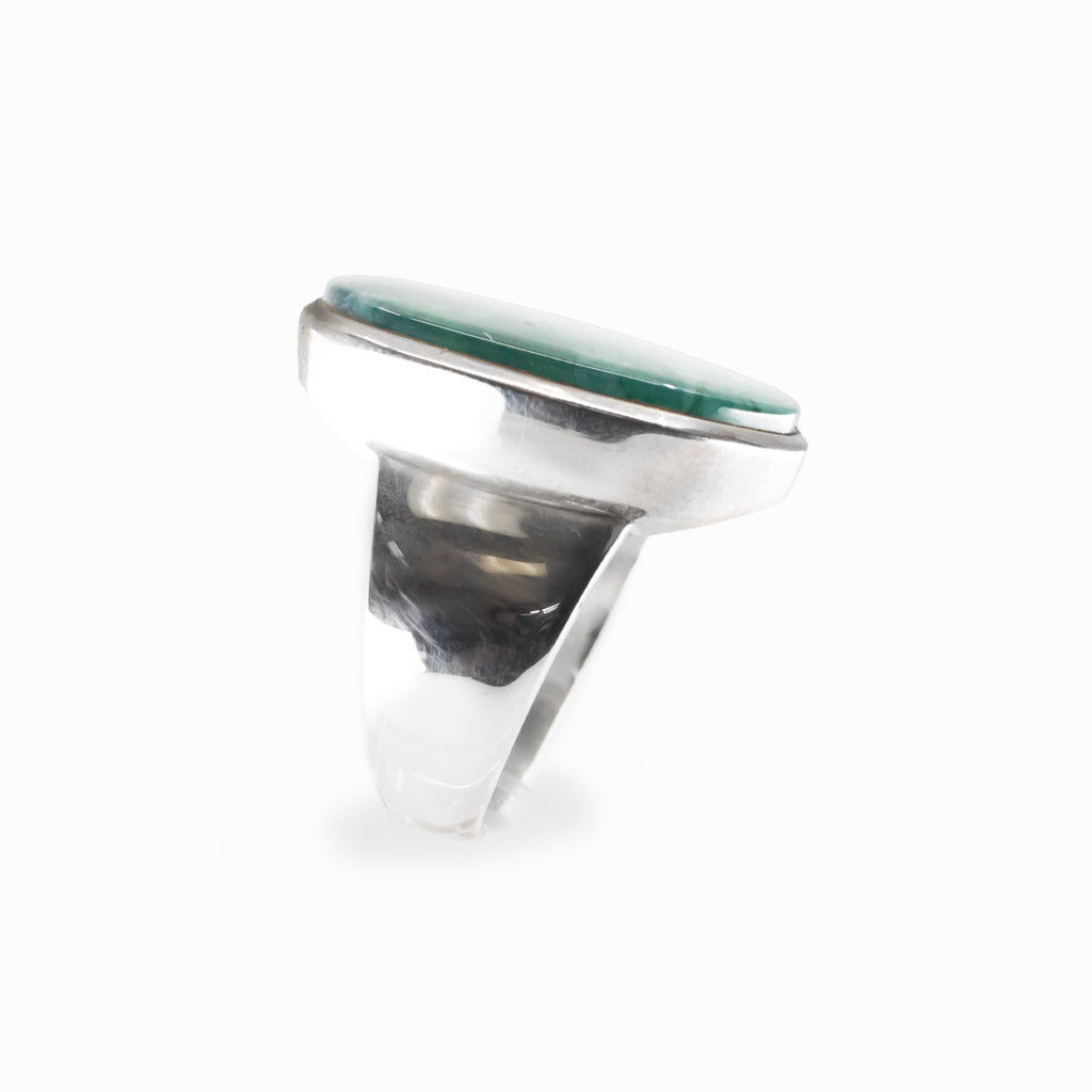 Oval Moss Agate cabochon sterling silver statement ring with natural green moss-like inclusions.