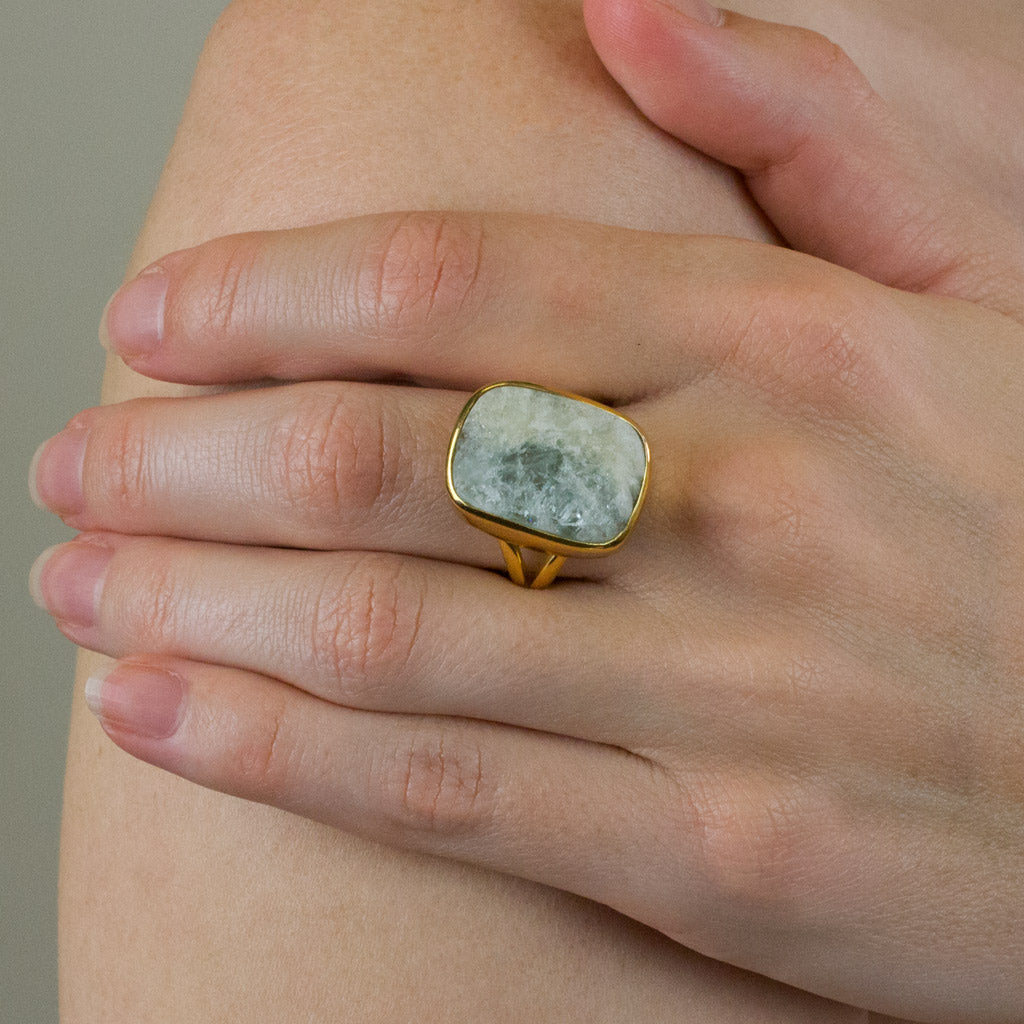 Aquamarine raw ring with gold vermeil finish on model