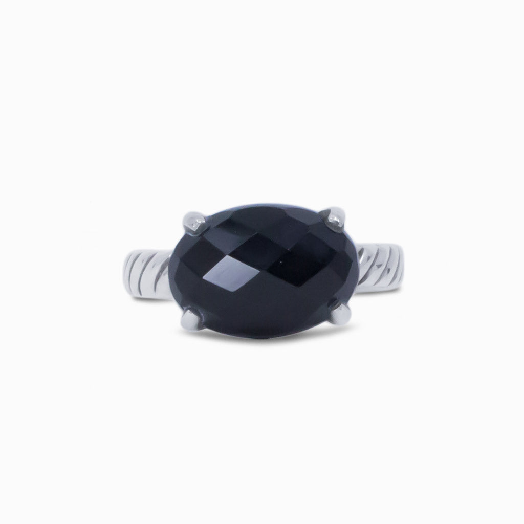 FACETED OVAL ONYX RING